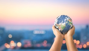 person holding a globe