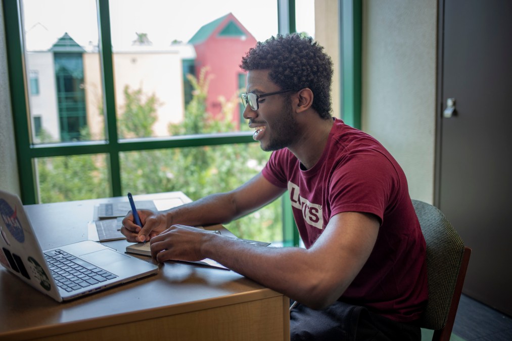 uni student studying in library