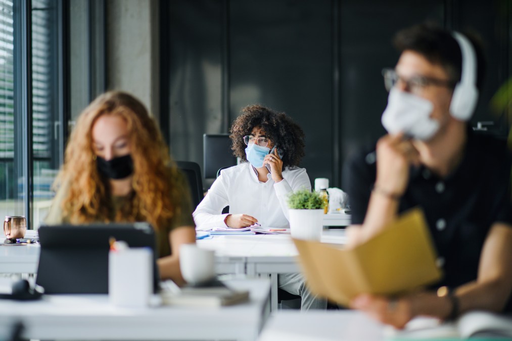 students wearing masks in a classroom