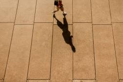 student walking shadow