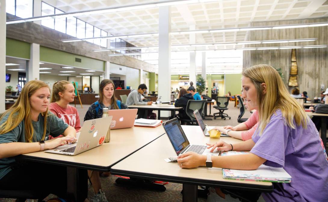 students sitting at a table at Columbus State University