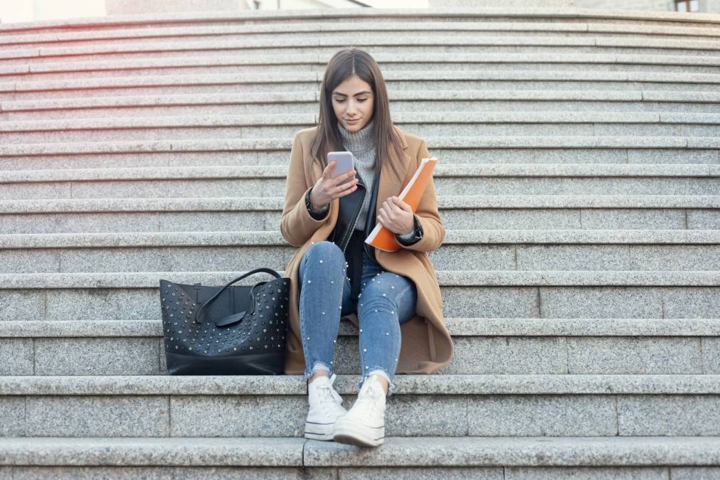 young woman sitting on stairs