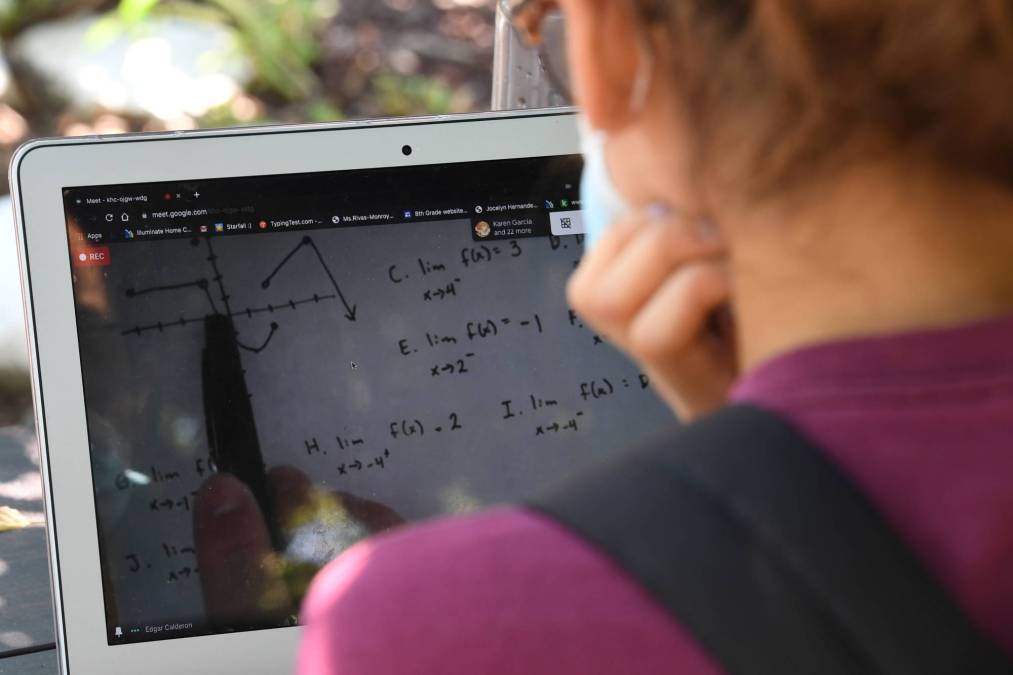 student watching calculus lecture on laptop