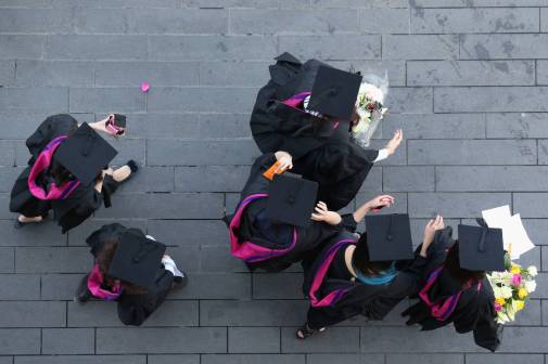 students wearing caps and gowns