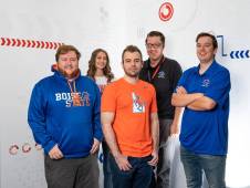 Boise State University Cyberdome students pose for a photo wearing their school's colors.